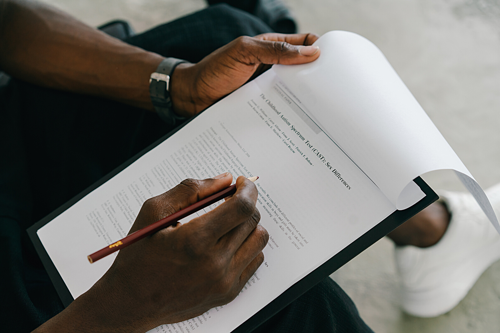 Person Writing on White Paper